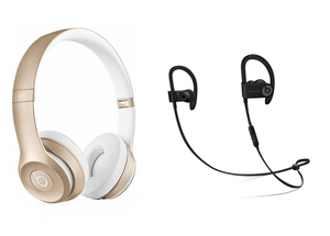 Gold Beats Headphones and a pair of Bluetooth Earphones